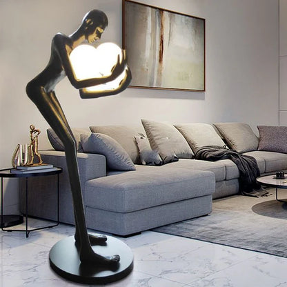 Human Sculpture Hugging Ball Floor Lamp